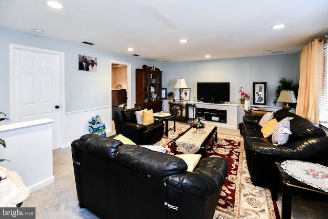 living area featuring recessed lighting, carpet, and visible vents