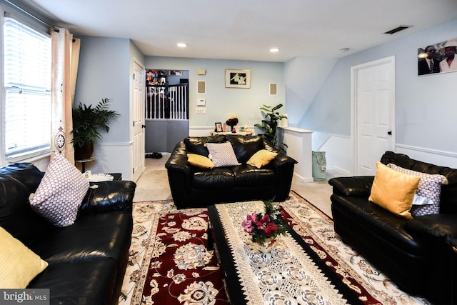 carpeted living room with plenty of natural light, recessed lighting, and visible vents