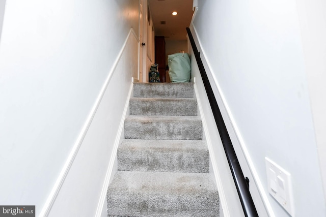 stairs featuring recessed lighting and carpet floors