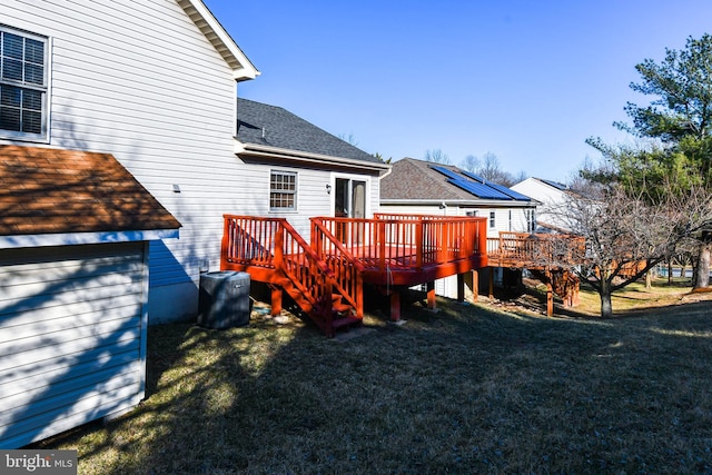 back of house featuring stairs, a yard, roof with shingles, and a wooden deck