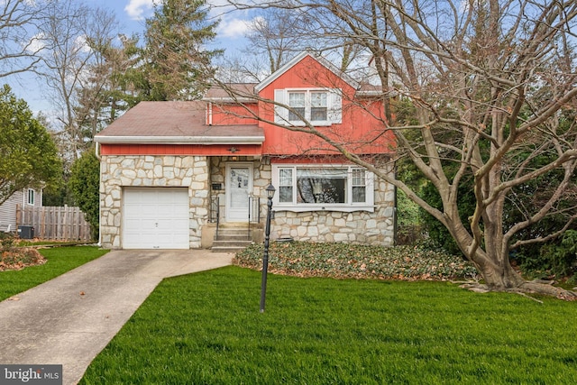 view of front facade featuring a garage, concrete driveway, fence, central AC, and a front yard