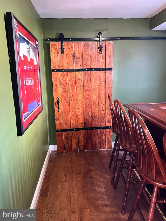 3246 Blundell Rd, Falls Church, VA 22042 - bar with wood-type flooring, baseboards, and a barn door