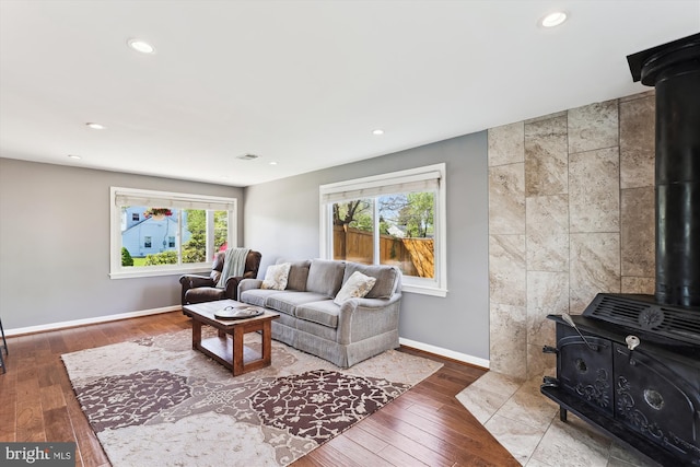 3246 Blundell Rd, Falls Church, VA 22042 - living room featuring recessed lighting, a wood stove, visible vents, wood-type flooring, and baseboards