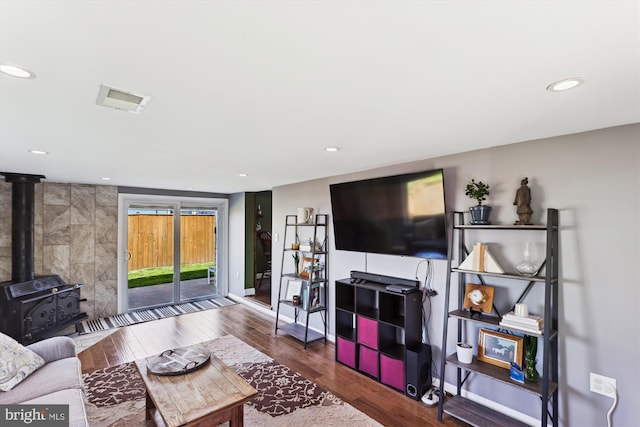 3246 Blundell Rd, Falls Church, VA 22042 - living area with wood finished floors, a wood stove, baseboards, visible vents, and recessed lighting