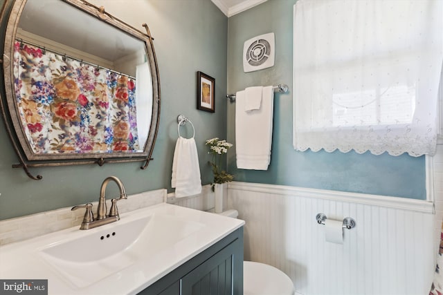3246 Blundell Rd, Falls Church, VA 22042 - full bathroom featuring visible vents, toilet, vanity, ornamental molding, and wainscoting