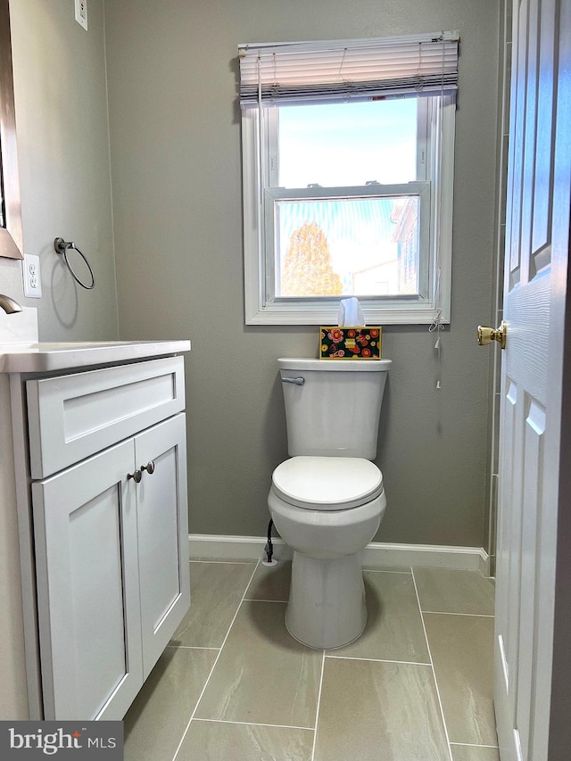 3246 Blundell Rd, Falls Church, VA 22042 - half bathroom featuring baseboards, vanity, and toilet