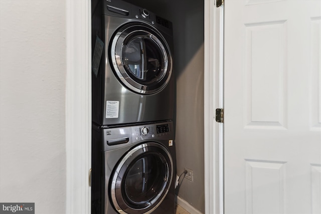 3246 Blundell Rd, Falls Church, VA 22042 - laundry room featuring stacked washer and dryer, baseboards, and laundry area