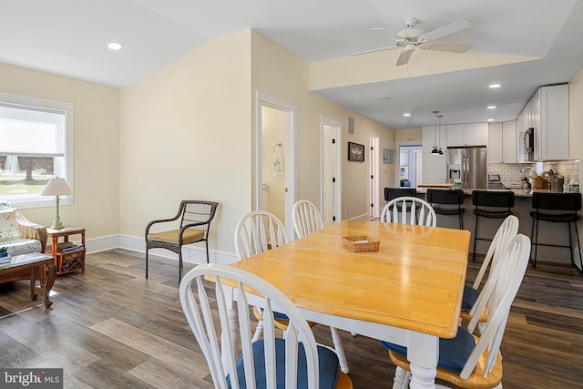 dining room with a ceiling fan, dark wood-style floors, baseboards, lofted ceiling, and recessed lighting