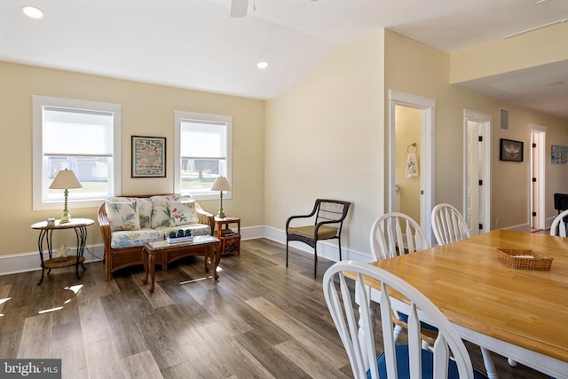 dining room with vaulted ceiling, recessed lighting, baseboards, and wood finished floors