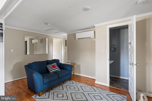 sitting room with a wall mounted air conditioner, attic access, wood finished floors, and crown molding