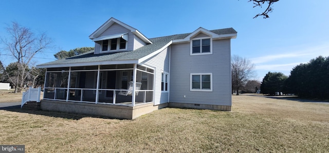 rear view of property with crawl space, a yard, and a sunroom