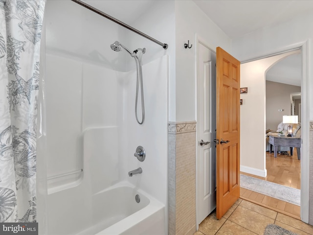 bathroom featuring shower / bath combination with curtain and tile patterned floors