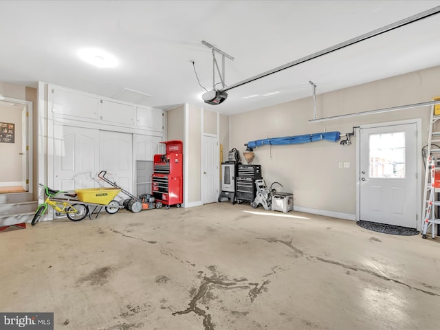 garage featuring baseboards and a garage door opener