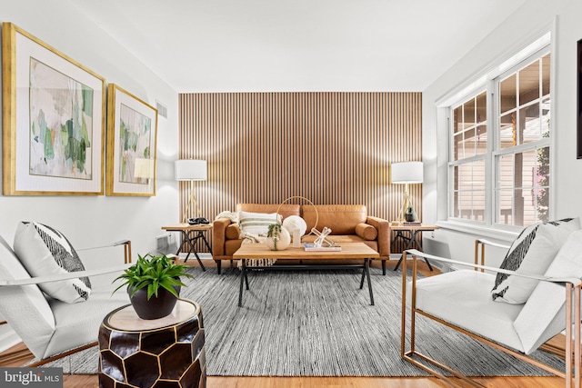 living room featuring visible vents and wood finished floors