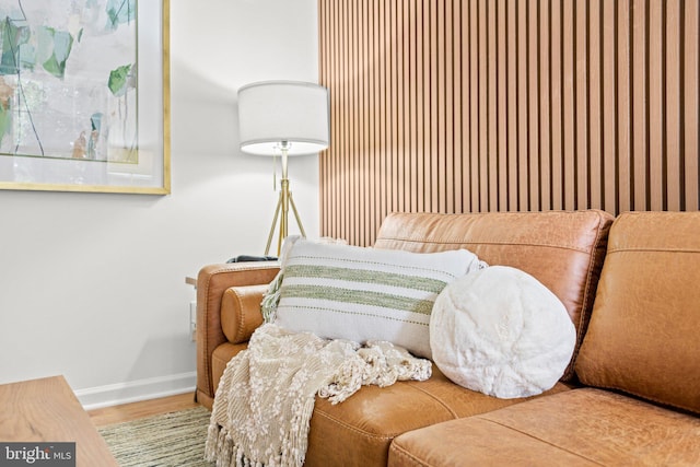 bedroom with baseboards and wood finished floors