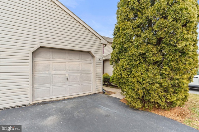 garage featuring driveway