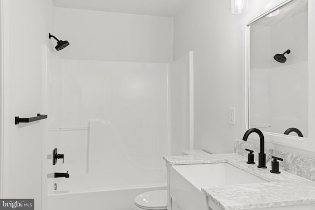 full bathroom featuring vanity, toilet, and shower / bathtub combination