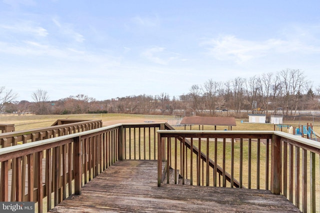 wooden deck with a lawn