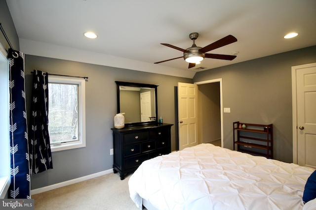 bedroom with recessed lighting, baseboards, light colored carpet, and visible vents