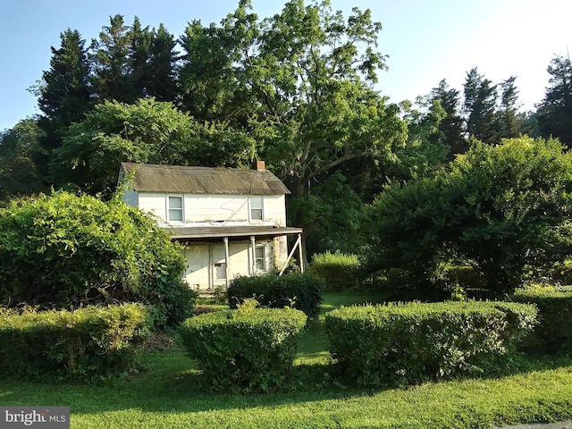 view of side of property with a chimney