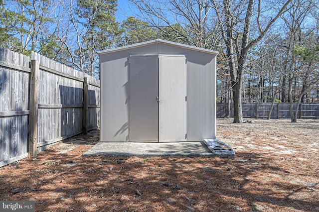 view of shed with a fenced backyard