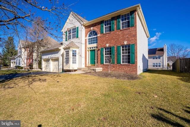 view of front of house with driveway, a garage, brick siding, fence, and a front yard