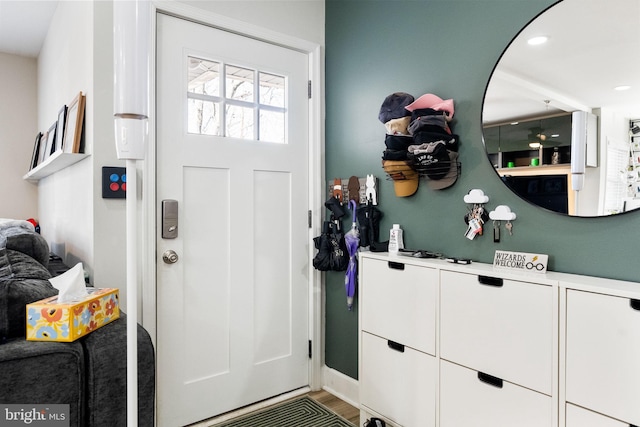 entryway featuring wood finished floors and recessed lighting