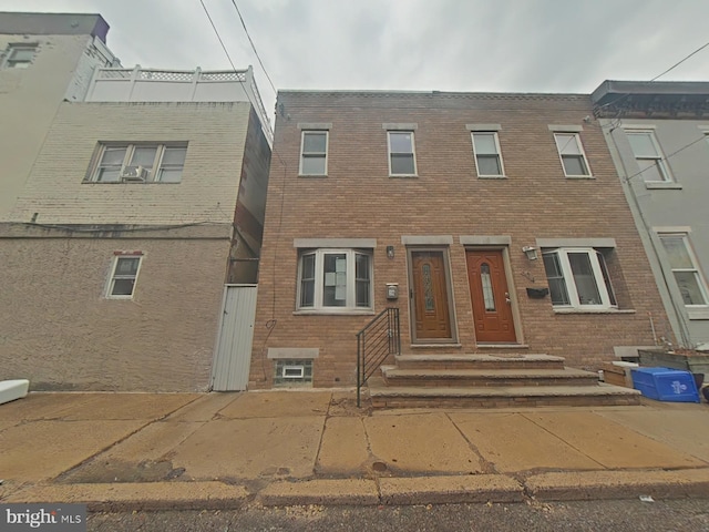 view of property featuring brick siding