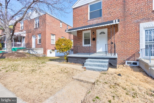 view of front of home with brick siding