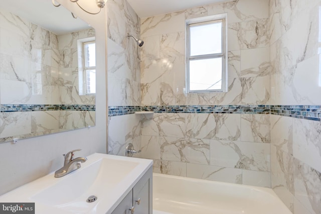 full bathroom featuring bathtub / shower combination and vanity