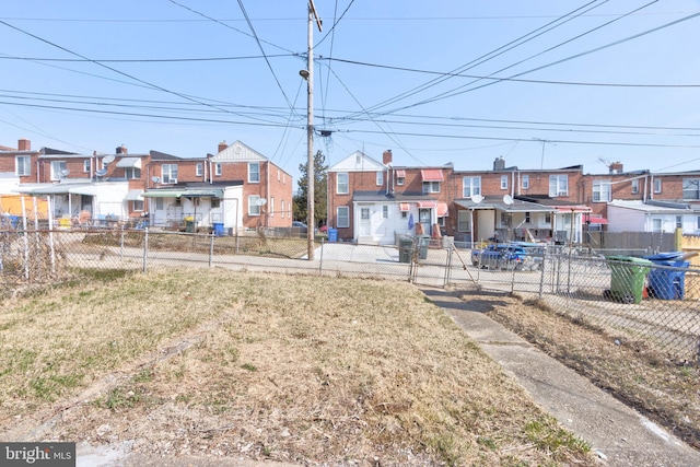 view of yard with fence and a residential view