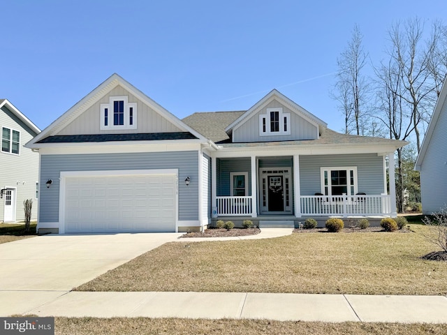 view of front facade featuring concrete driveway, roof with shingles, a front yard, covered porch, and a garage