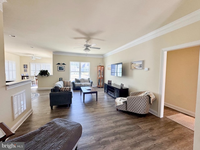 living area with visible vents, crown molding, baseboards, ceiling fan, and dark wood-style flooring