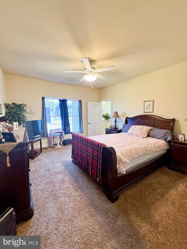 carpeted bedroom with ceiling fan