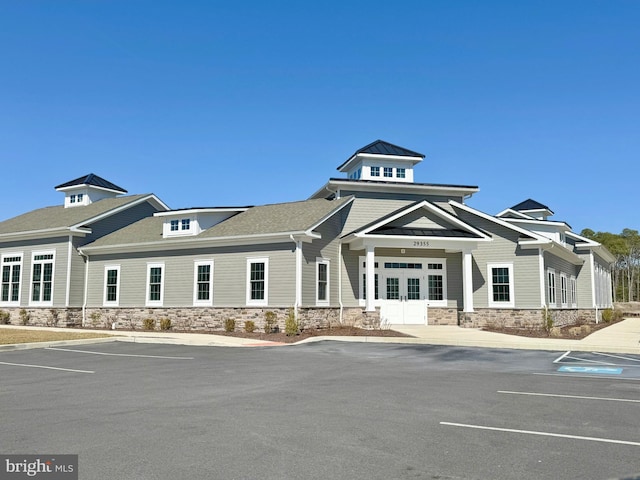 view of property featuring uncovered parking