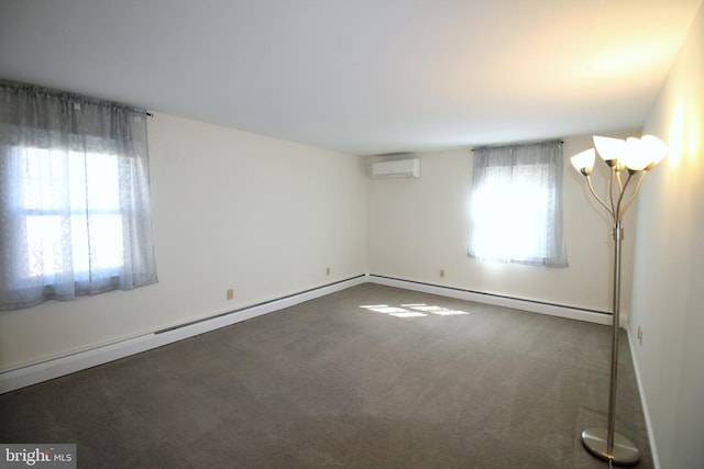 spare room with a baseboard heating unit, a wall mounted air conditioner, and carpet flooring