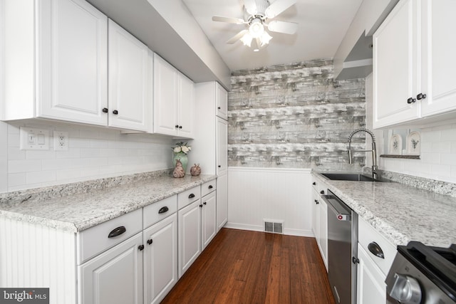 kitchen with visible vents, a sink, white cabinetry, range, and dishwasher