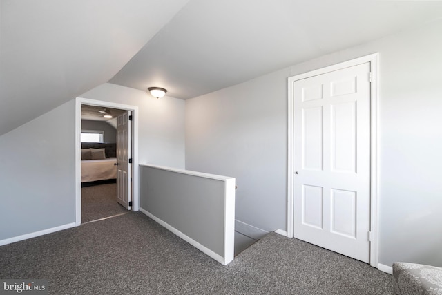 bonus room with baseboards, carpet floors, and lofted ceiling