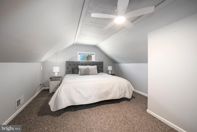 carpeted bedroom with a ceiling fan, vaulted ceiling, baseboards, and visible vents