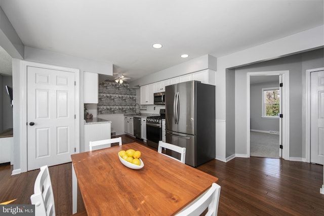 dining room featuring dark wood-style floors, recessed lighting, a ceiling fan, and baseboards