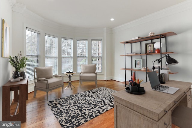 interior space with ornamental molding, light wood finished floors, recessed lighting, and baseboards