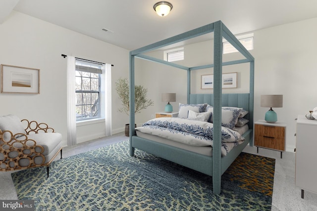 carpeted bedroom with visible vents and baseboards