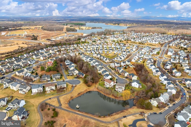 bird's eye view featuring a residential view and a water view