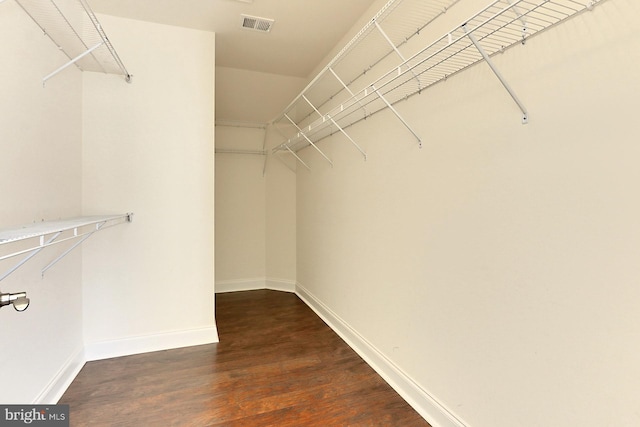 spacious closet with visible vents and wood finished floors