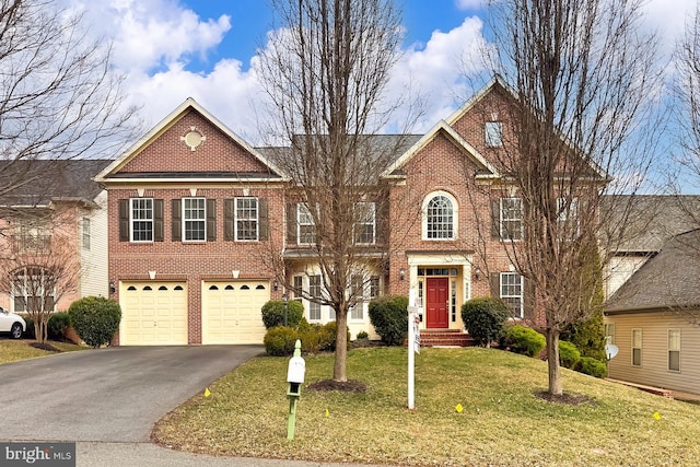 view of front of house featuring an attached garage, a front lawn, aphalt driveway, and brick siding