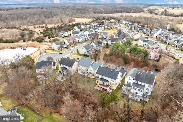 aerial view featuring a water view and a residential view