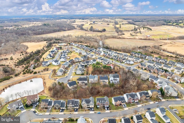 bird's eye view with a residential view and a water view