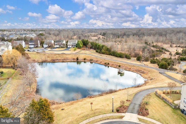 drone / aerial view featuring a water view and a residential view