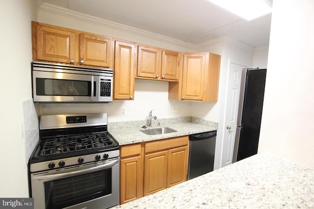 kitchen with stainless steel appliances, light stone counters, a sink, and crown molding