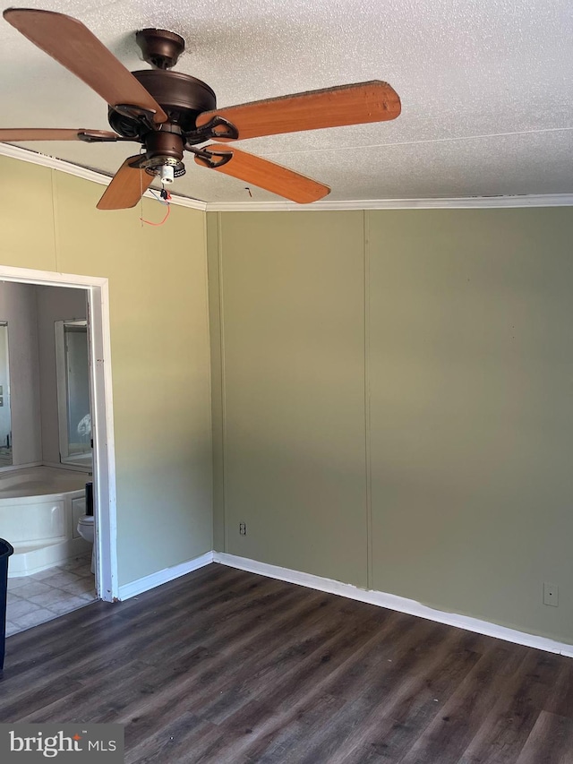 unfurnished room featuring a textured ceiling, wood finished floors, a ceiling fan, baseboards, and ornamental molding